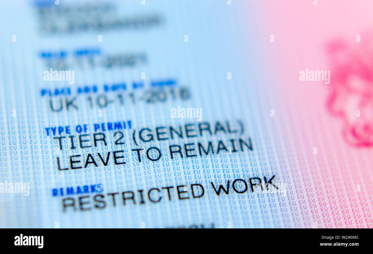 UK Tier 2 Visa BRP (Biometrical Residence Permit) card macro photo. Stock Photo