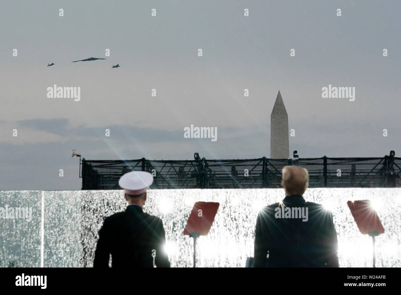 Washington DC, USA. 04th July, 2019. U.S President Donald Trump joined by the Chairman of Joint Chiefs of Staff General Joseph Dunford, left, watches an aircraft flyover at the Salute to America event at the Lincoln Memorial July 4, 2019 in Washington, D.C. Credit: Planetpix/Alamy Live News Stock Photo