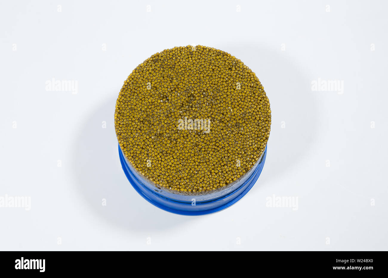 Exquisite caviar on a white background in a jar. Stock Photo