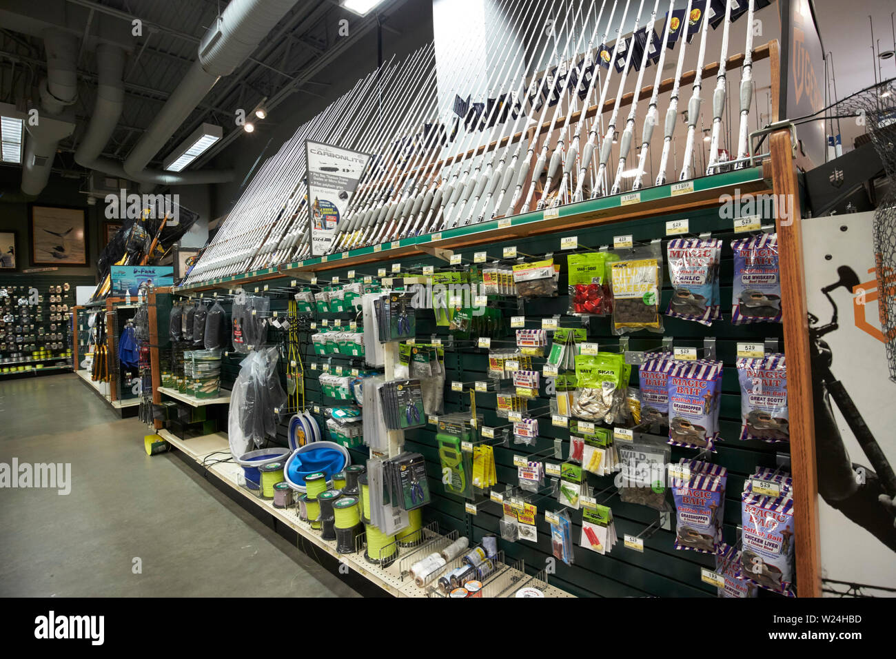 fishing rods and equipment on sale in a bass pro shops retail sporting goods store savannah georgia usa Stock Photo