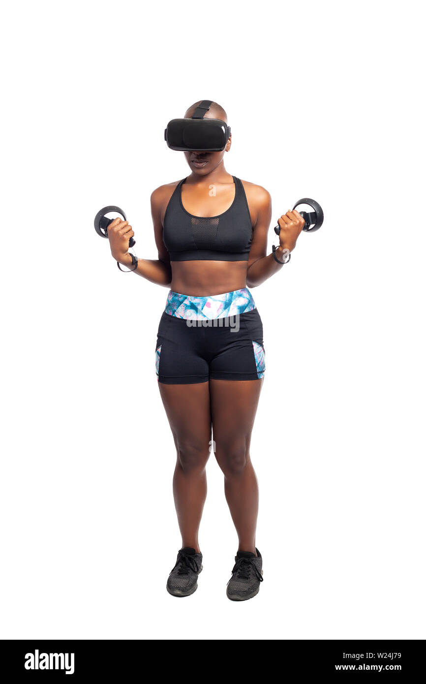 Athletic black female gamer wearing a vr headset and exercising in a