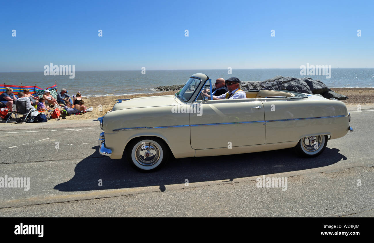 Classic White Ford Zephyr Mk1 convertible Motor Car being driven along Seafront Promenade. Stock Photo