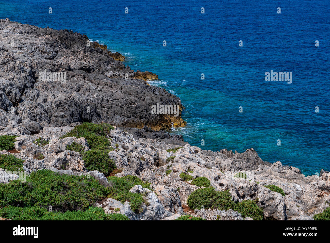 View over the rocky coast at the North Cape of Zakynthos, beautiful blue sea Stock Photo