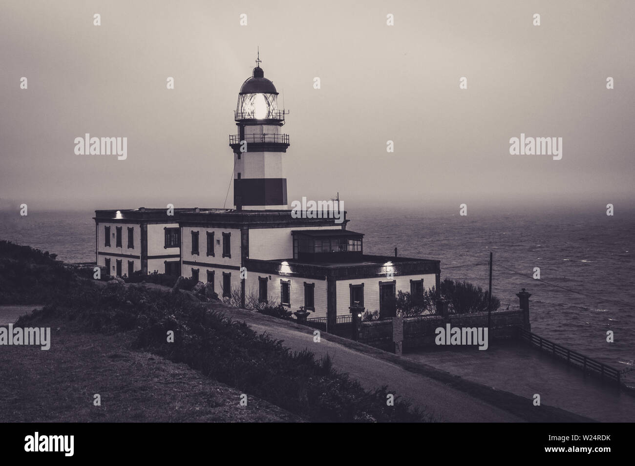 Cape Silleiro lighthouse on a stormy day. The lighthouse is located in Baiona province of Pontevedra, Spain Stock Photo