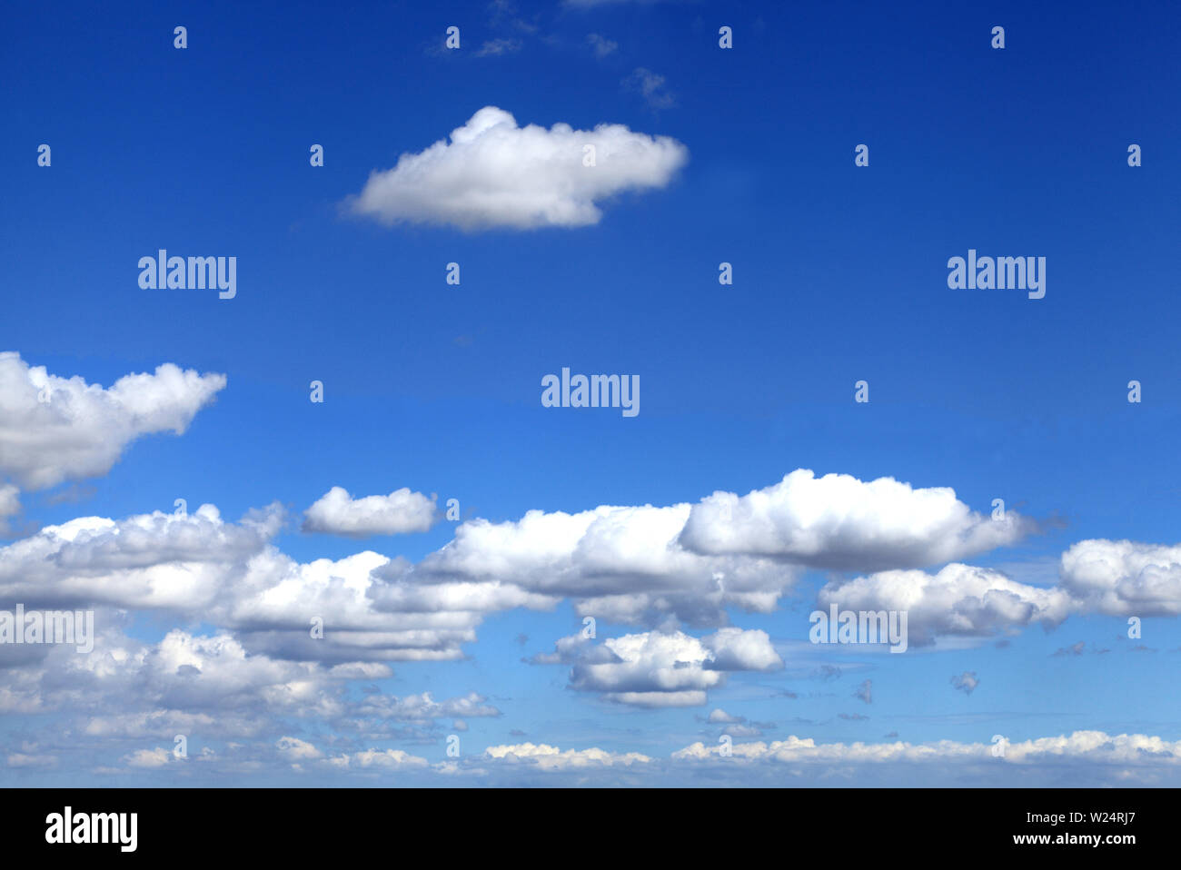 white cumulus cumulous cloud clouds blue sky, England, UK Stock Photo