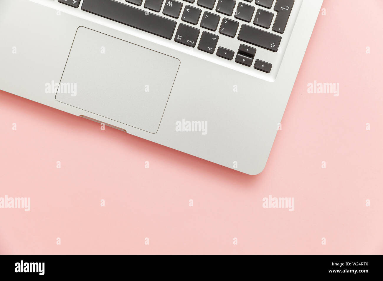 Keyboard laptop computer isolated on pink pastel desk background ...