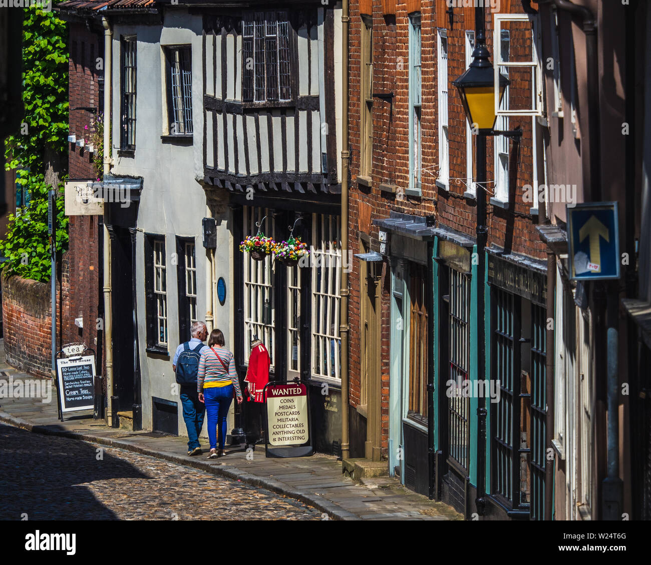 Elm Hill Norwich - a historic cobbled lane in central Norwich, UK. The street contains a number of historic buildings dating back to Tudor times. Stock Photo