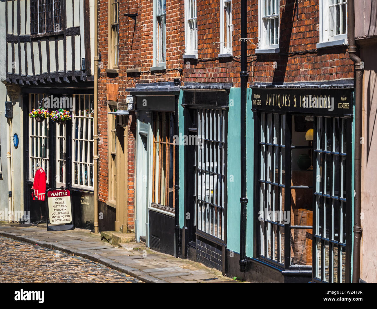 Elm Hill Norwich - a historic cobbled lane in central Norwich, UK. The street contains a number of historic buildings dating back to Tudor times. Stock Photo