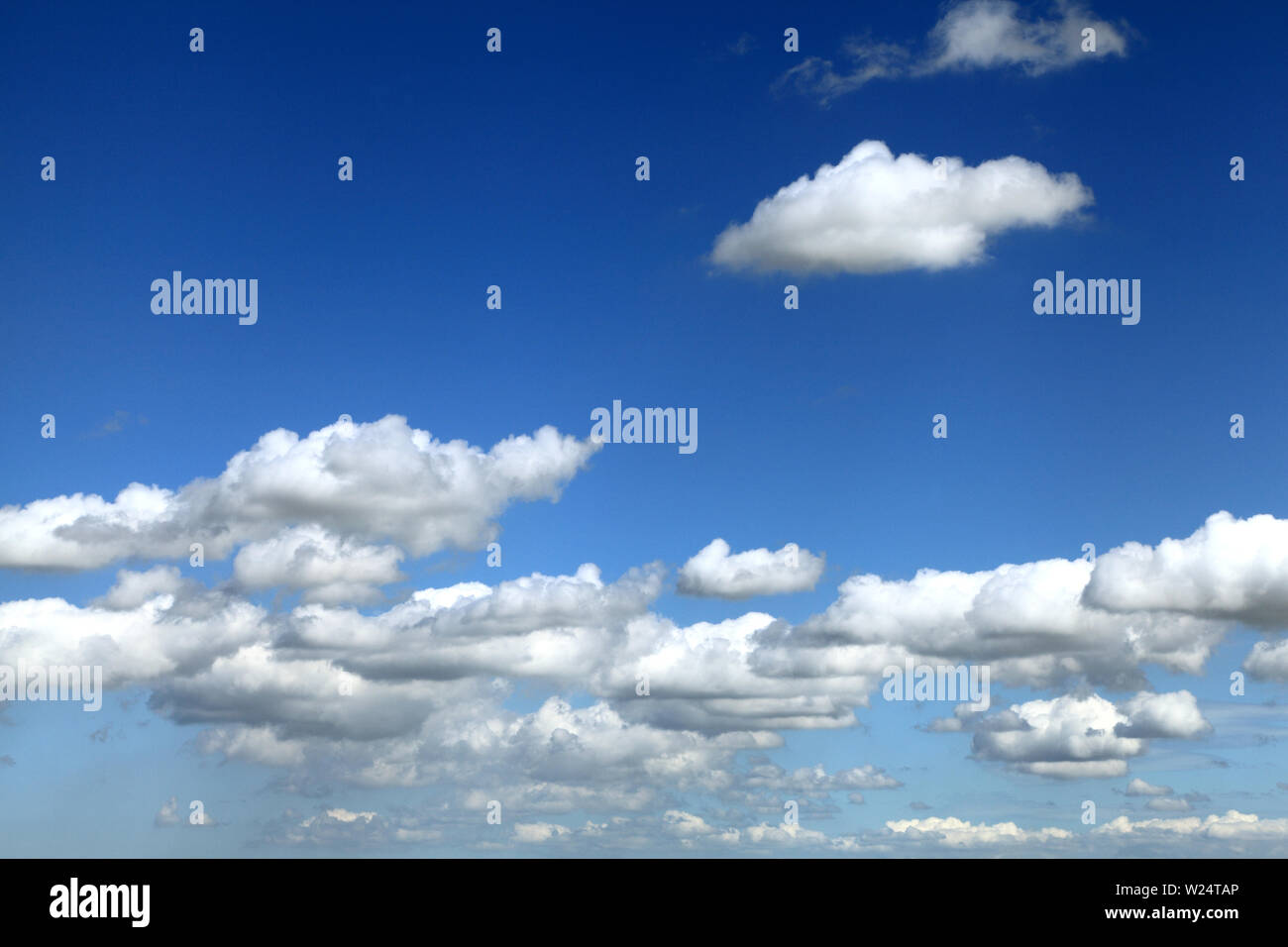 white cumulus cumulous cloud clouds blue sky, England, UK Stock Photo