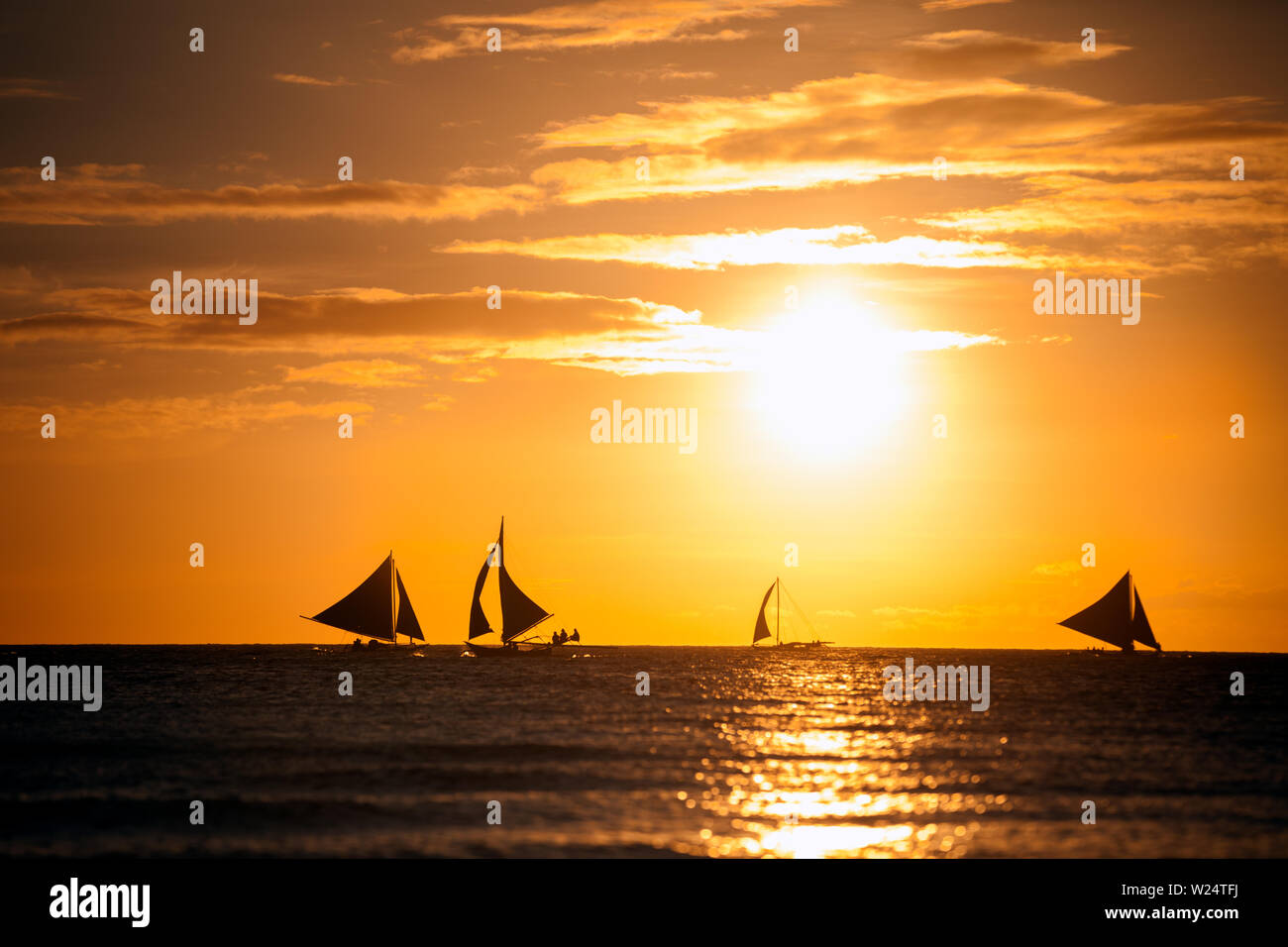 Sailboats on the sea, romantic sunset scenery Stock Photo - Alamy