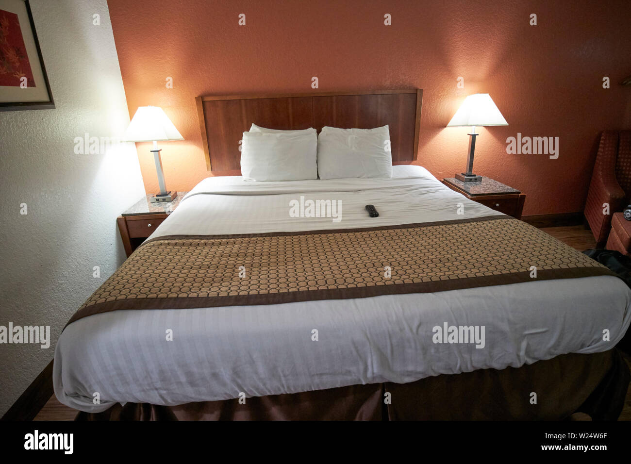 king sized bed in a cheap hotel room georgia usa Stock Photo