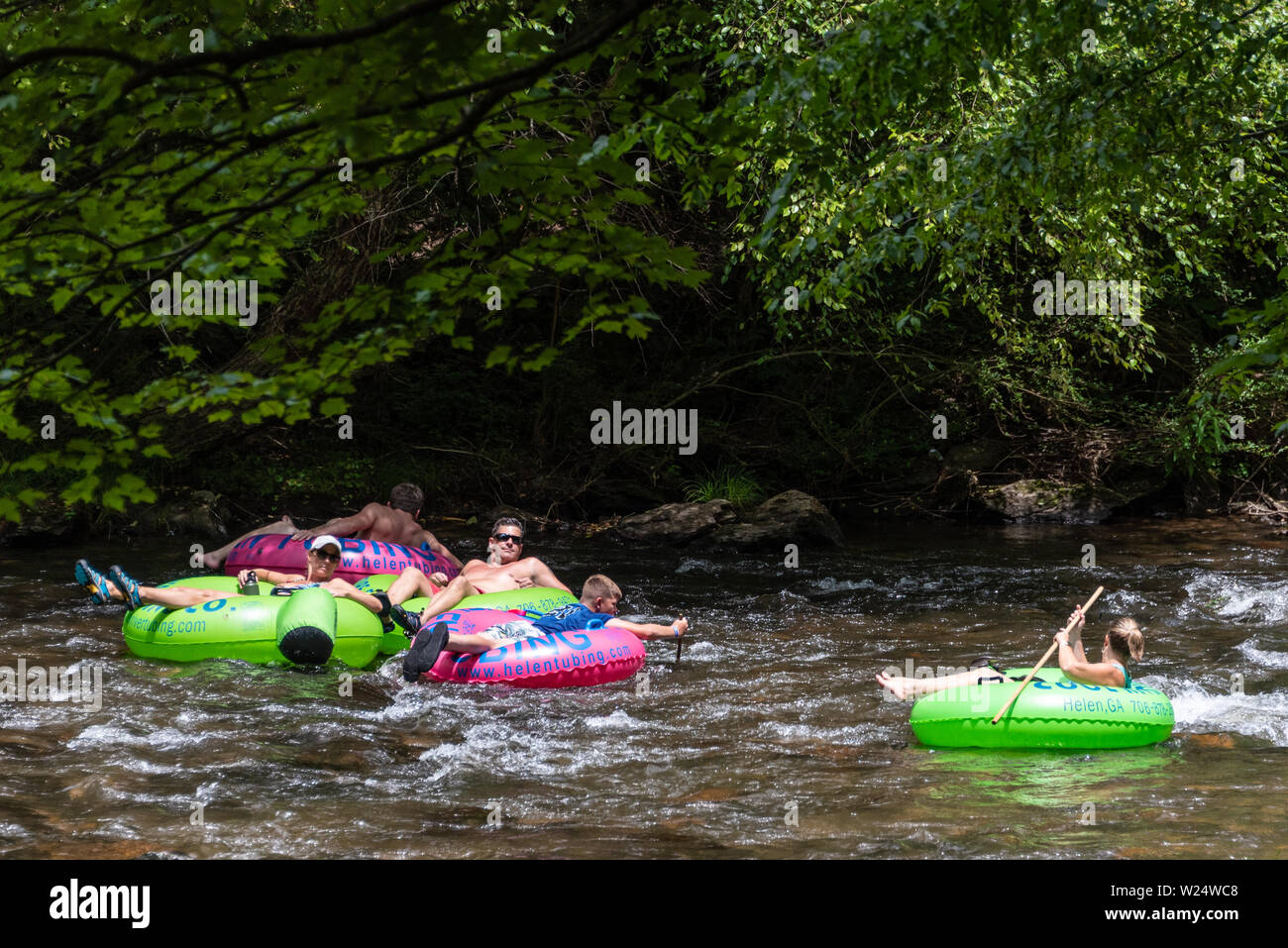 Family tubing on the Chattahoochee River in Helen, Georgia. (USA) Stock Photo