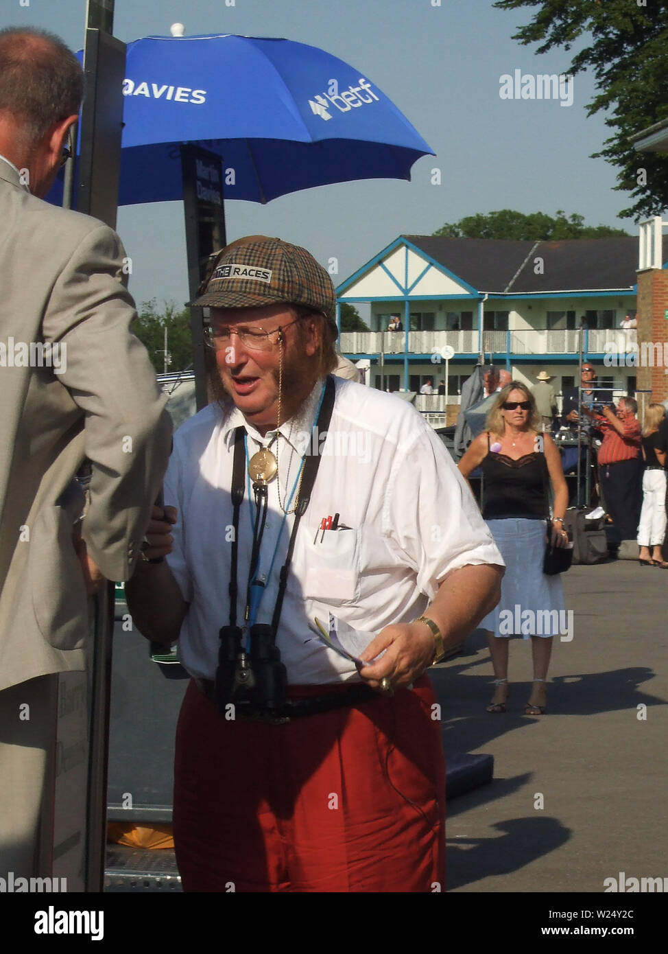 Windsor Racecourse, Berkshire, UK. 3rd July, 2006. Racing pundit John McCririck puts a bet on the races at Monday night racing at Royal Windsor Racecourse. Credit: Maureen McLean/Alamy Stock Photo