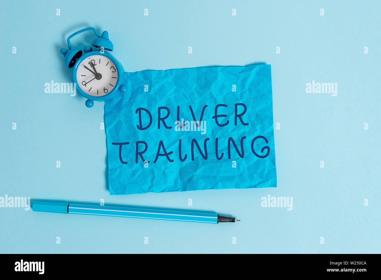 Writing note showing Driver Training. Business concept for prepares a new driver to obtain a driver s is license Metal vintage alarm clock crushed she Stock Photo