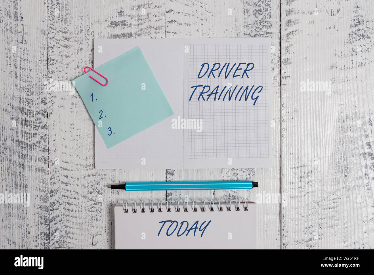 Word writing text Driver Training. Business photo showcasing prepares a new driver to obtain a driver s is license Open squared spiral notepad clip no Stock Photo
