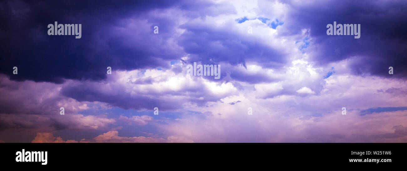Dark blue stormy cloudy sky natural photo background Stock Photo - Alamy