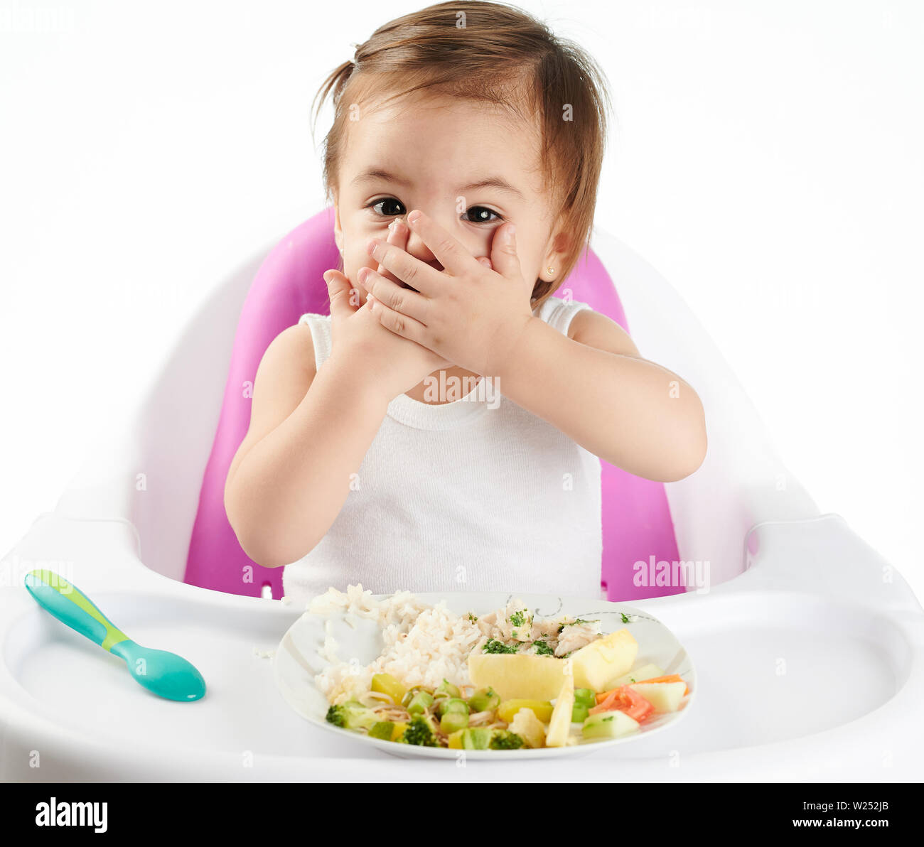Baby closed mouth with hands. Child dont want to eat theme Stock Photo