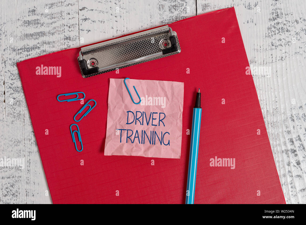 Writing note showing Driver Training. Business concept for prepares a new driver to obtain a driver s is license Colored clipboard crushed sticky note Stock Photo