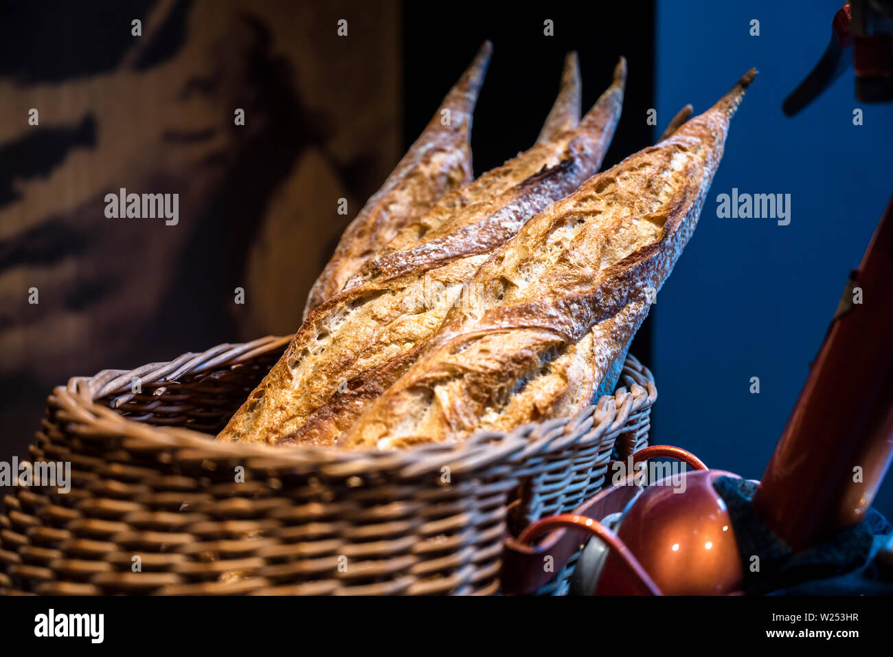 The production of French baguettes is a bakers art. You need to knead the dough properly to get an airy crispy baguette. A professional baker by hand Stock Photo