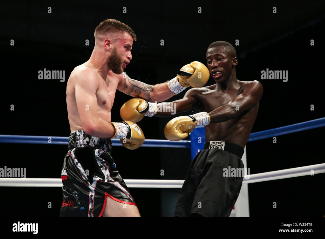 Tommy Frank lands a big left hook on John Chuwa during the Dennis Hobson Promotions boxing event at Ponds Forge, Sheffield. Picture date: 5th July 201 Stock Photo