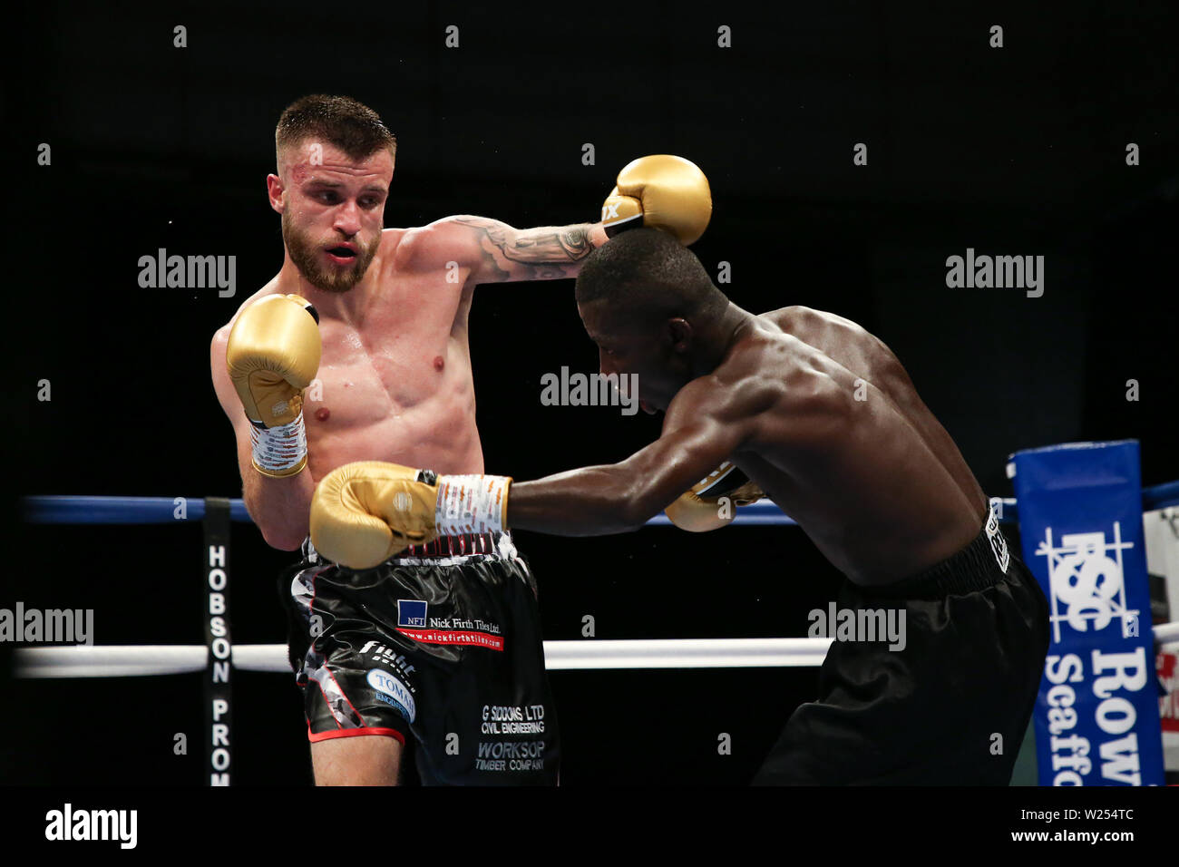 Tommy Frank lands a left hook on John Chuwa during the Dennis Hobson Promotions boxing event at Ponds Forge, Sheffield. Picture date: 5th July 2019. P Stock Photo