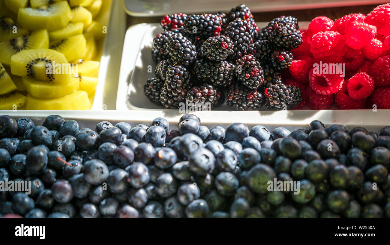 Natural organic raspberry, strawberry and blackberry berries with a