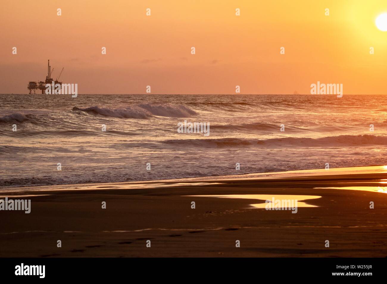 sunset over the ocean in Huntington Beach, California Stock Photo