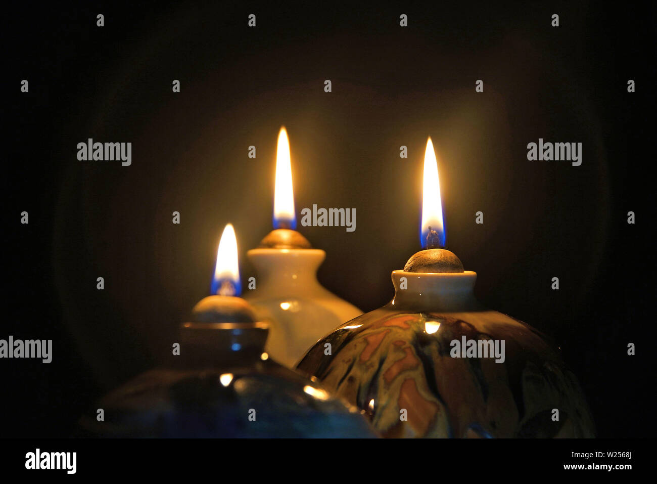 Oil lamp candle flame in the dark with halo effect Stock Photo Alamy