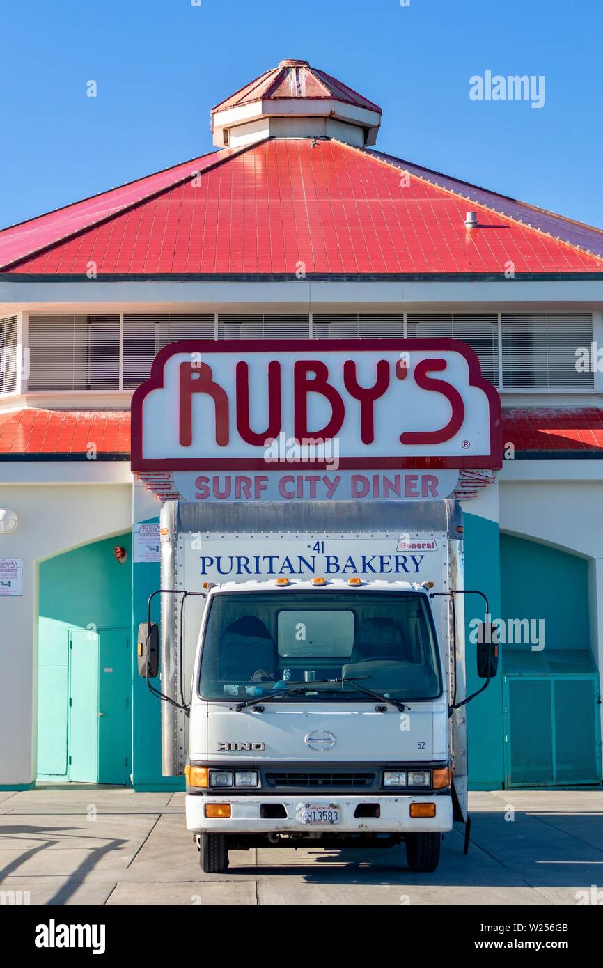 Puritan Bakery truck parked on the Huntington Beach Pier delivering food to Ruby's surf city diner Stock Photo