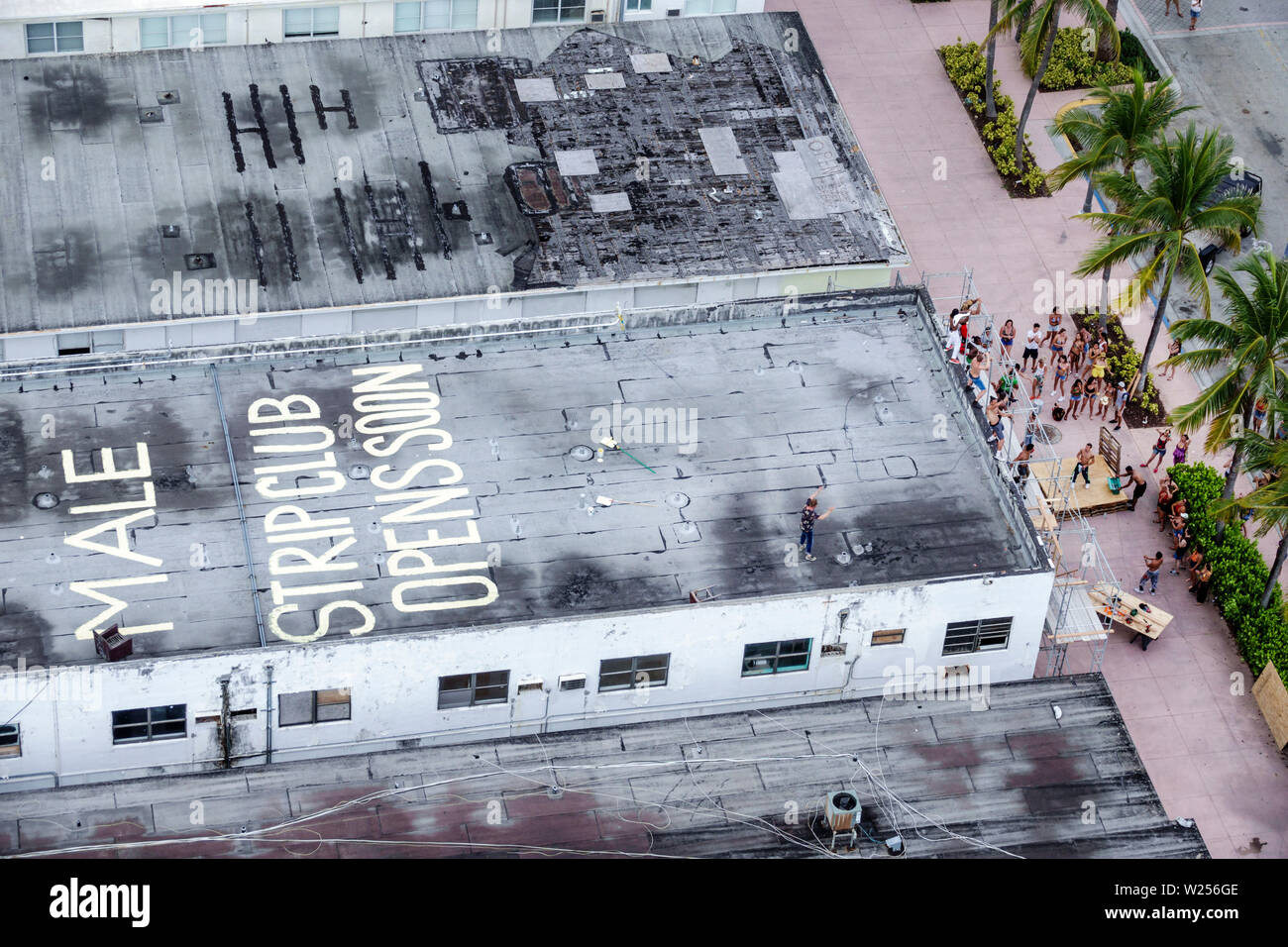 Miami Beach Florida,North Beach,Ocean Terrace,male strip club opens opening soon,movie shoot,crew,dancers,painted rooftop,FL190615003 Stock Photo