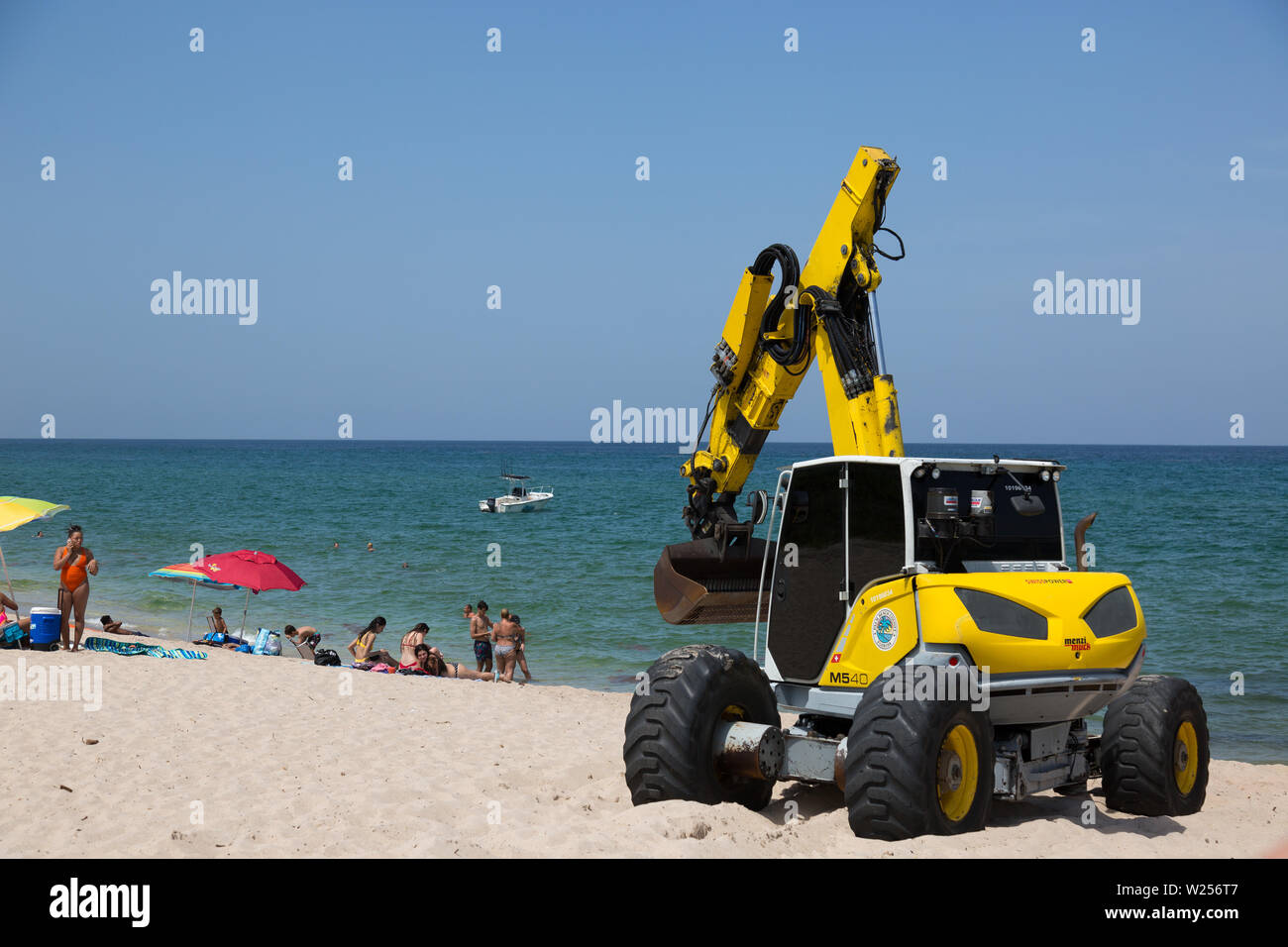 A Swiss Power Menzi Muck walking excavator works near the Boynton Inlet in Manalapan, Florida, USA. Stock Photo