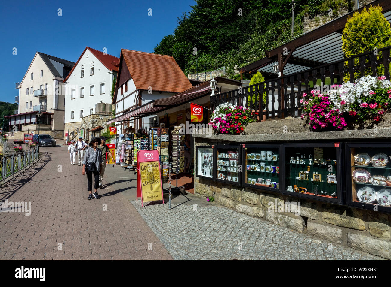 People on promenade in Kurort Rathen, Germany Saxon Switzerland, Sachsische Schweiz Elbe valley buildings Stock Photo