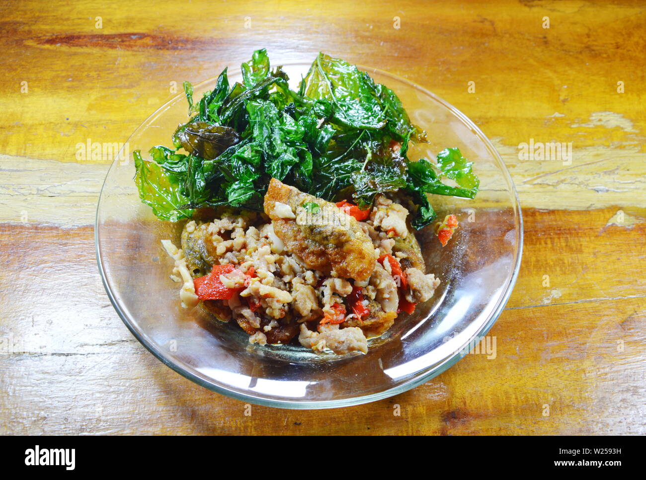 stir fried crispy basil leaf with black preserved egg and minced