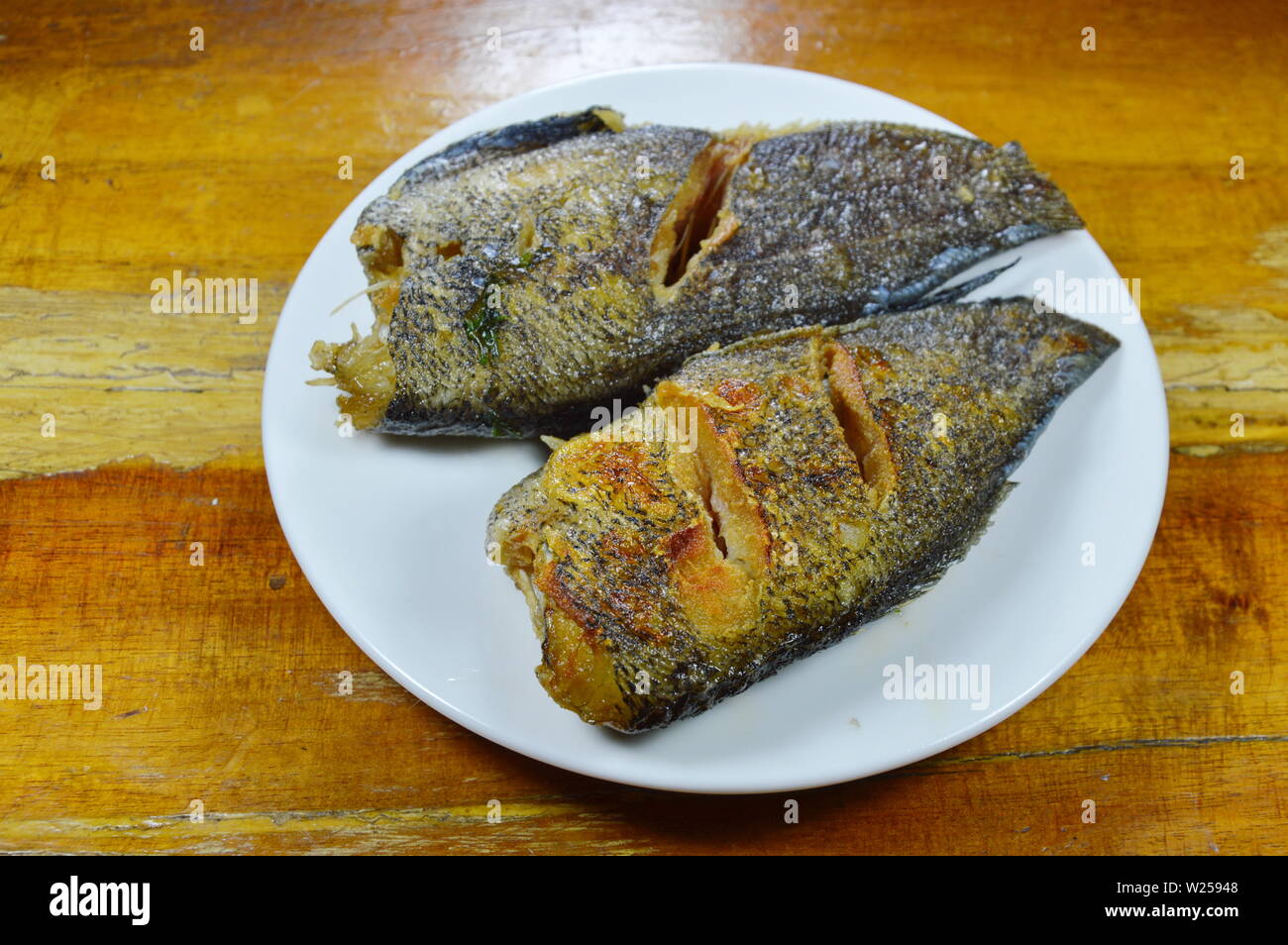 deep fried snake skin gourami on dish Stock Photo - Alamy