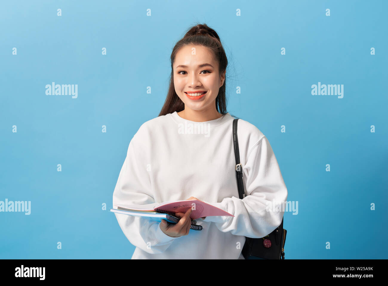 College Student girl. Isolated portrait of a beautiful young asian ...