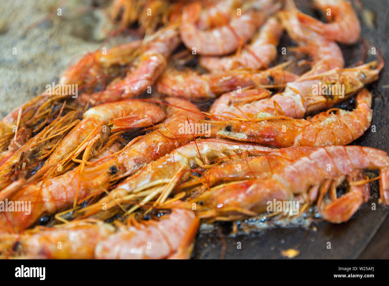 fast food cooking shrimps in boiling oil closeup outdoor Stock Photo