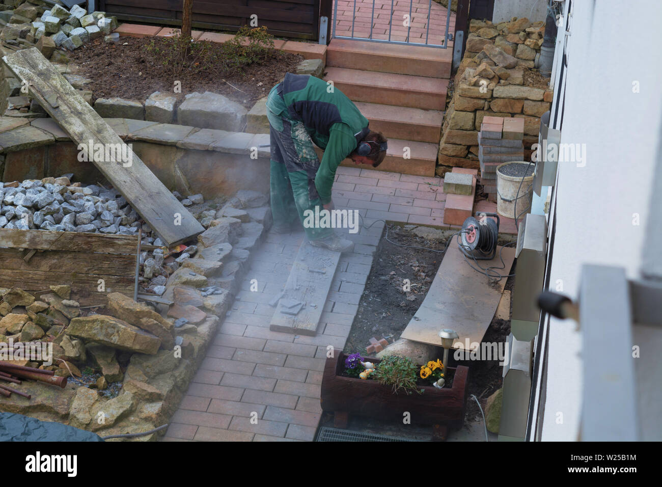 Reworking with technology Tile cutting with an angle grinder Stock Photo