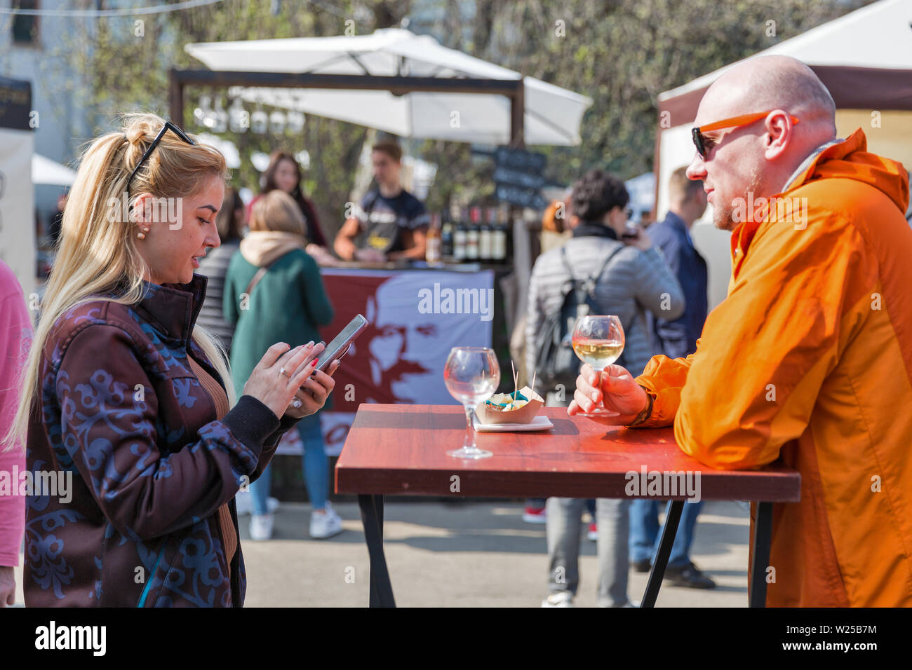 KYIV, UKRAINE - APRIL 21, 2019: People tasting wine during Food and Wine Festival in National Expocenter, a permanent multi-purpose exhibition complex Stock Photo