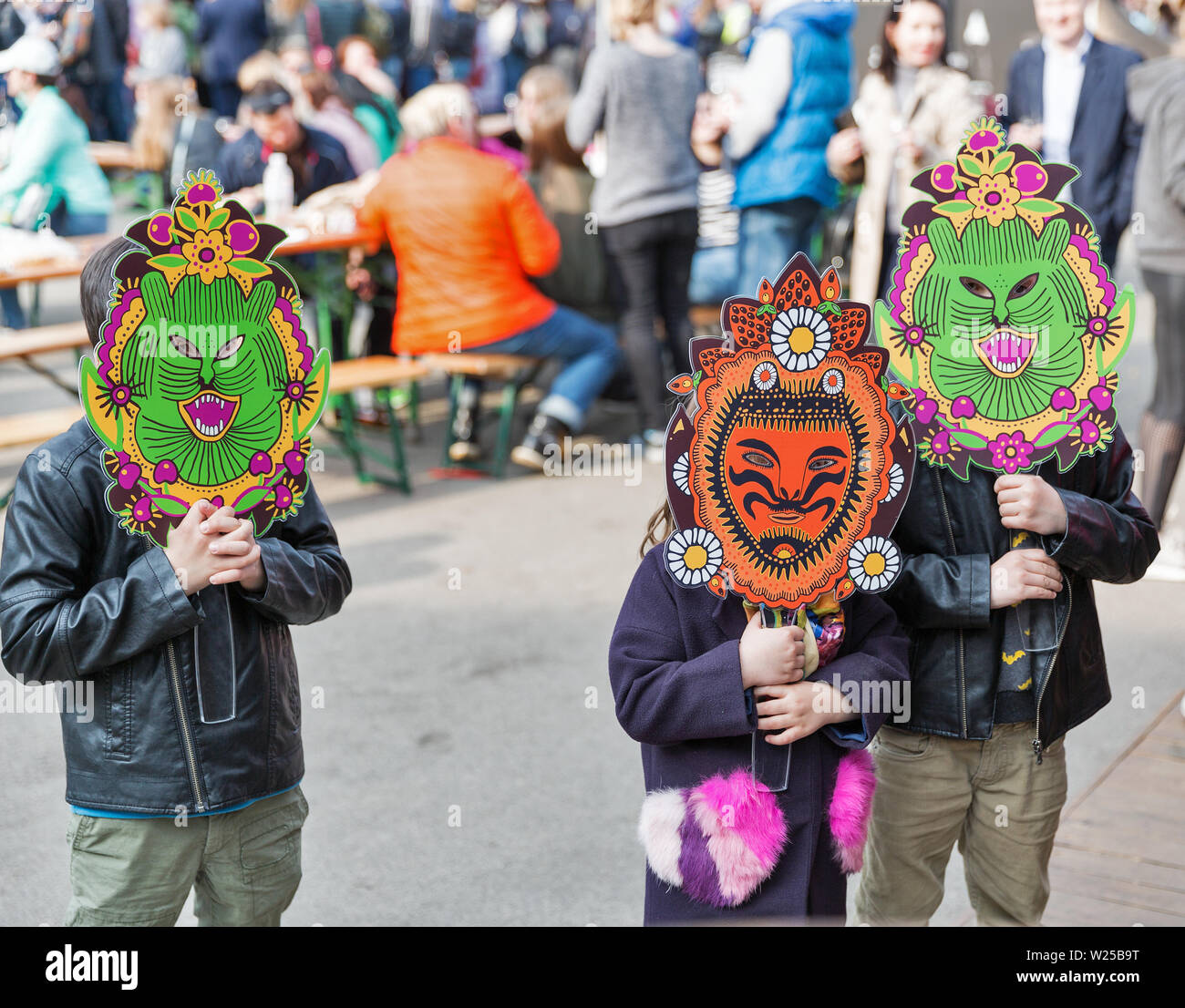 KYIV, UKRAINE - APRIL 21, 2019: Children wear funny monster mask during Food and Wine Festival in National Expocenter, a permanent multi-purpose exhib Stock Photo