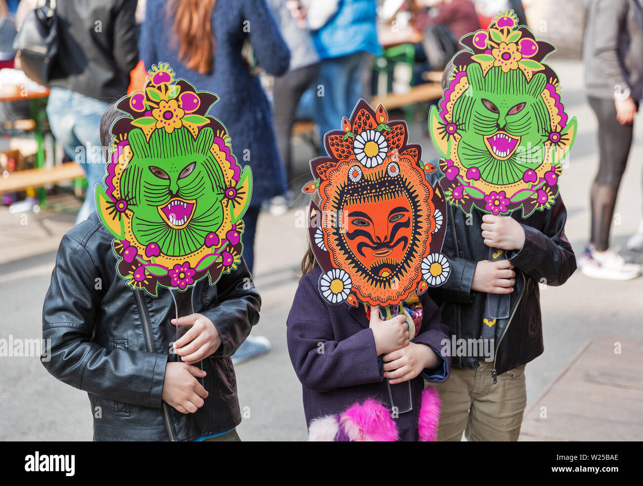 KYIV, UKRAINE - APRIL 21, 2019: Children wear funny monster mask during Food and Wine Festival in National Expocenter, a permanent multi-purpose exhib Stock Photo