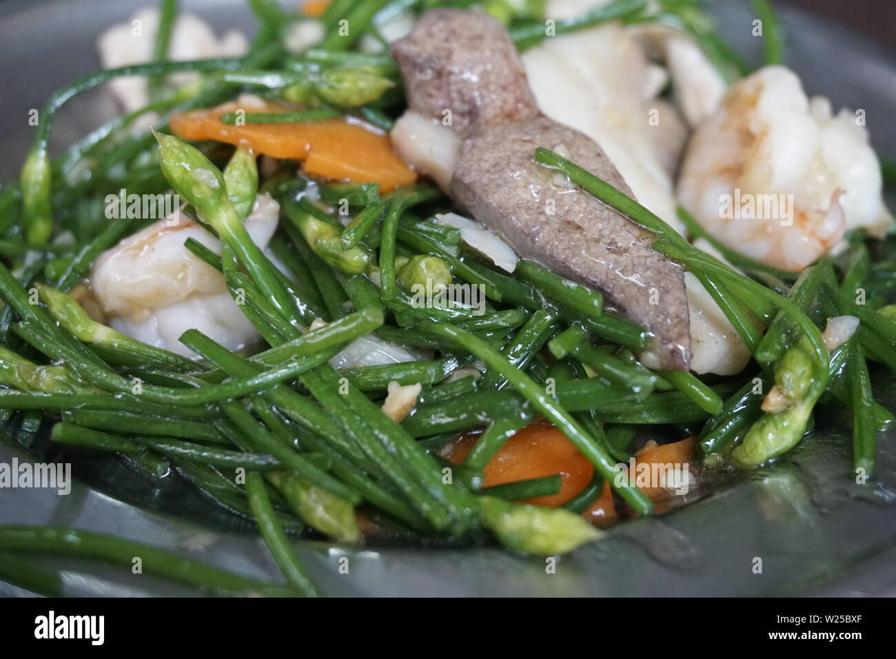 stir fried chives, Chinese cooking Stock Photo