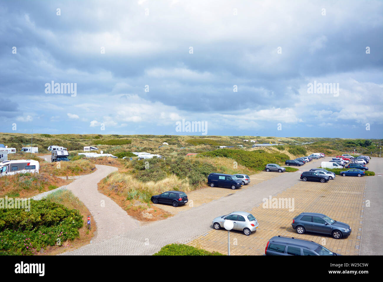 Camping site with big car parking space called 'Kogerstrand' in the dunes near beach in Texel, Holland Stock Photo