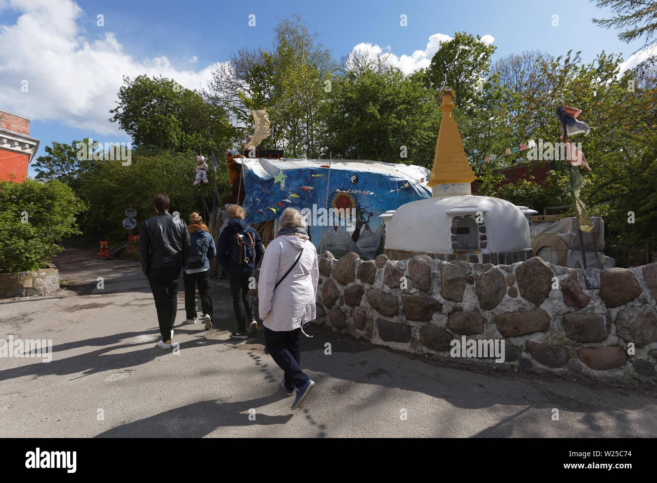 People walking in Freetown Christiania, an intentional community in the borough of Christianshavn in Copenhagen, Denmark Stock Photo