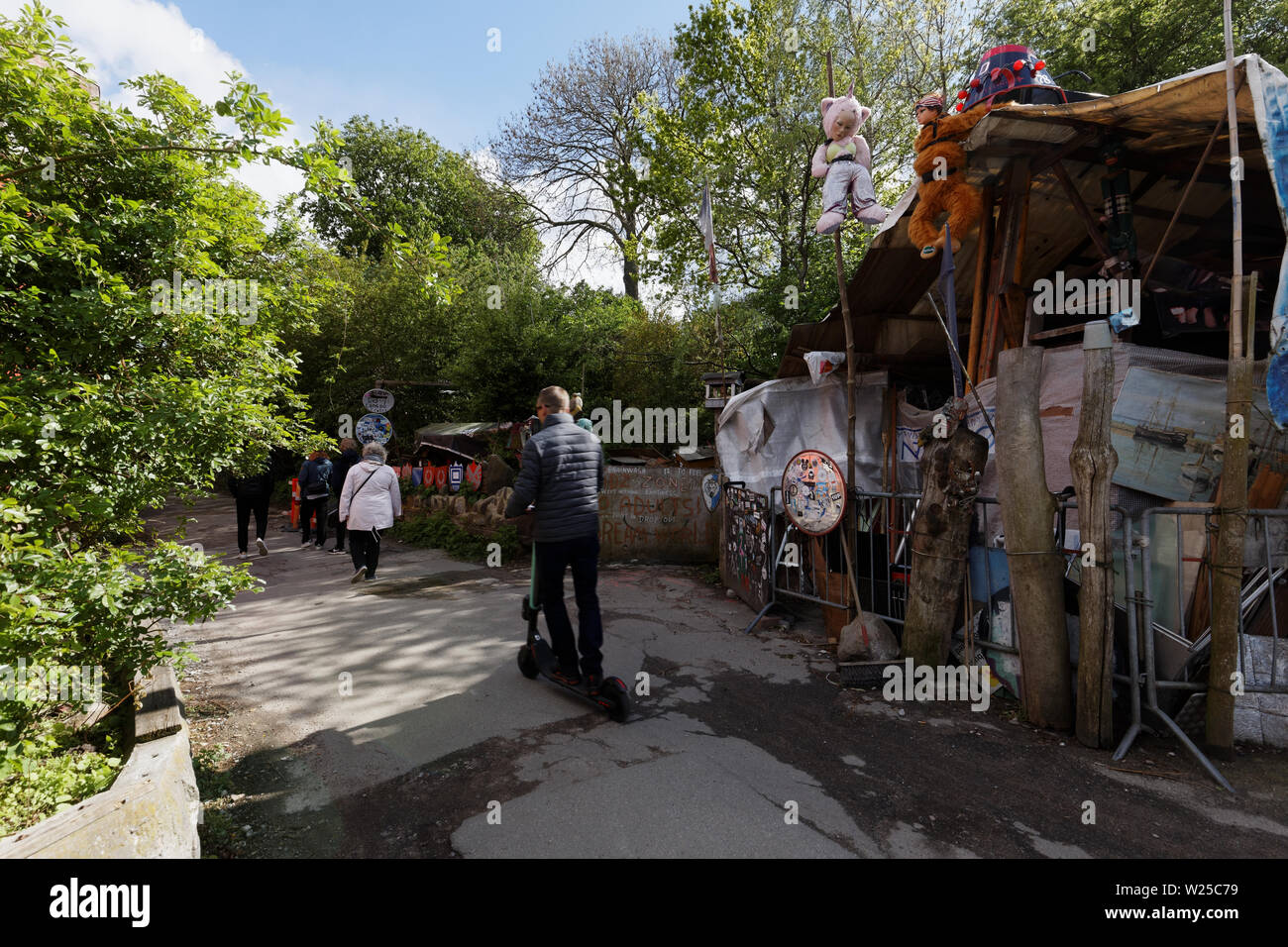 People walking in Freetown Christiania, an intentional community in the borough of Christianshavn in Copenhagen, Denmark Stock Photo