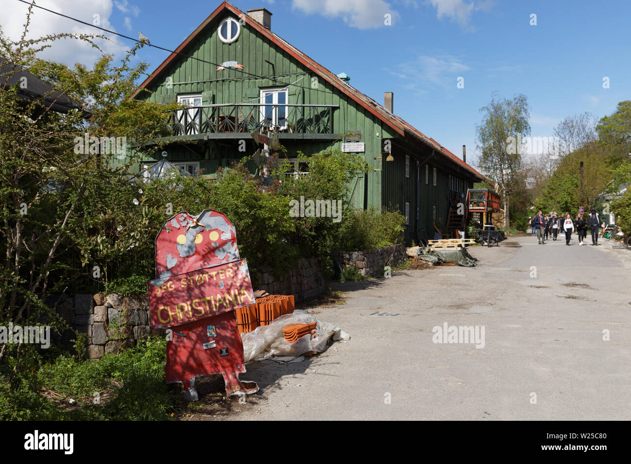 People walking in Freetown Christiania, an intentional community in the borough of Christianshavn in Copenhagen, Denmark Stock Photo