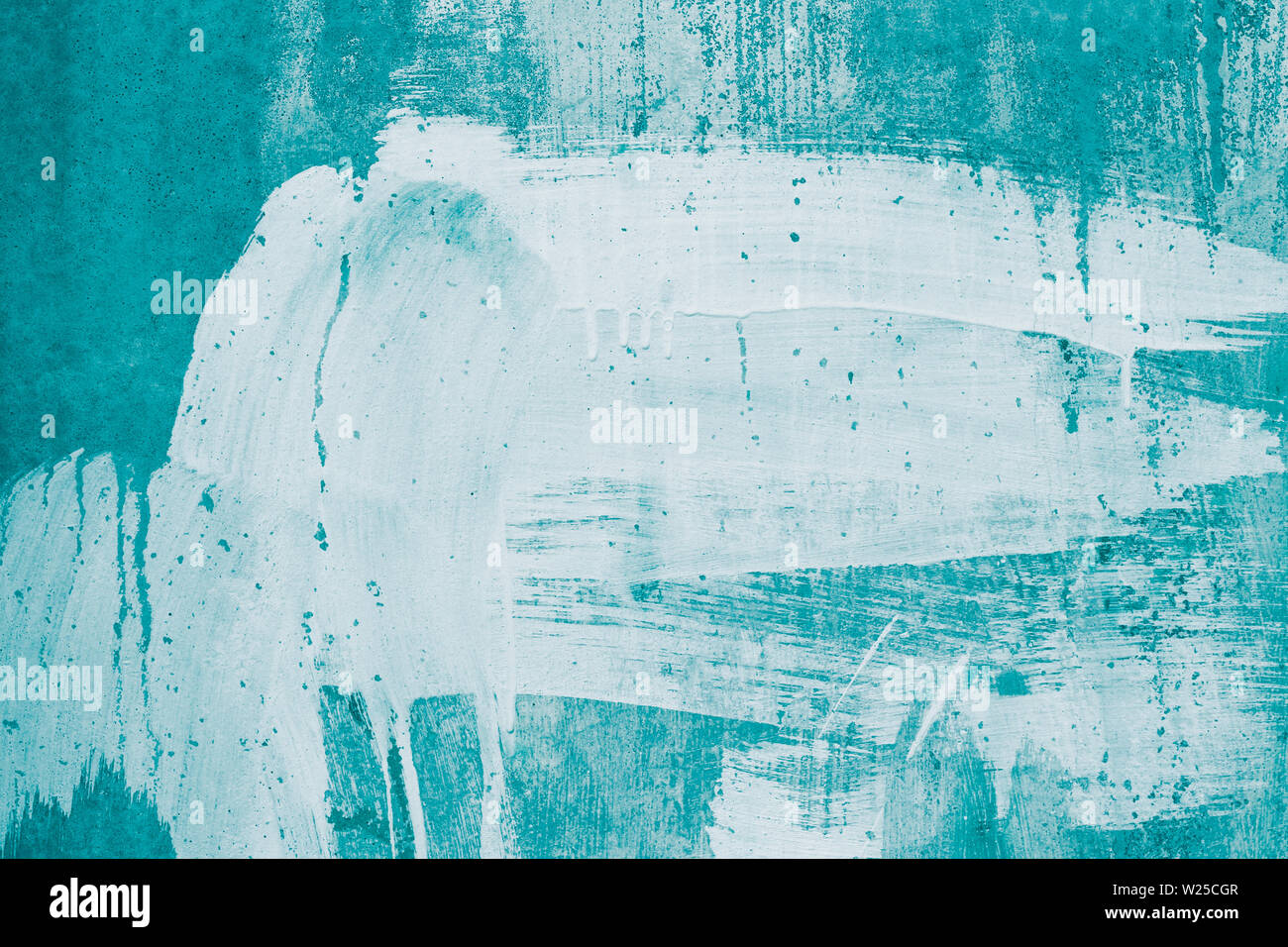 Drips of white paint on the turquoise wall. Painted dirty concrete wall