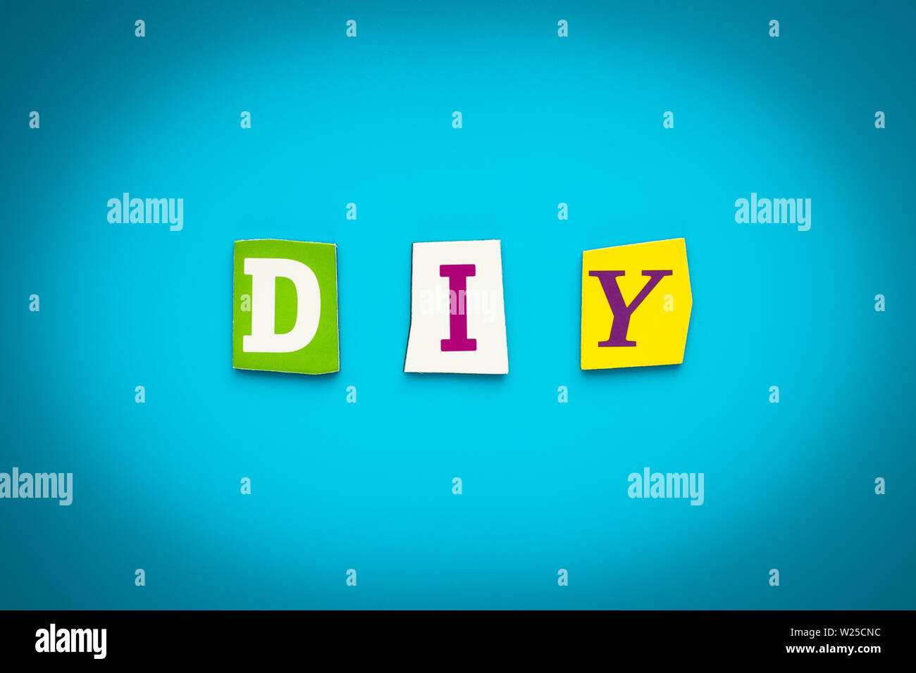 Text - D I Y - from colorful letters on blue background. Single word on banner. Message on poster. Abbreviation - Do It Yourself. Headline, card Stock Photo