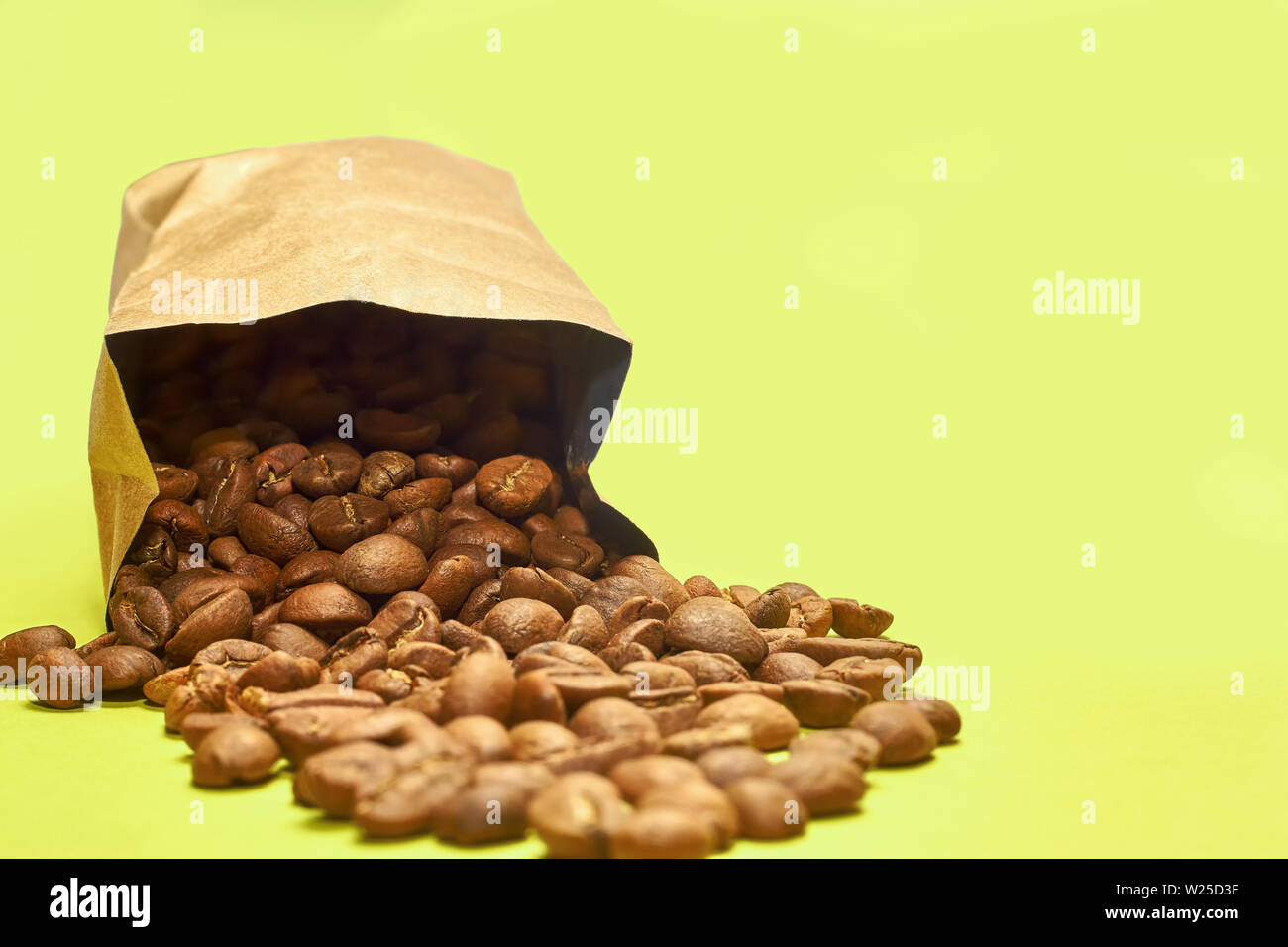Download Coffee Beans From A Paper Bag Isolated On A Yellow Background Stock Photo Alamy Yellowimages Mockups