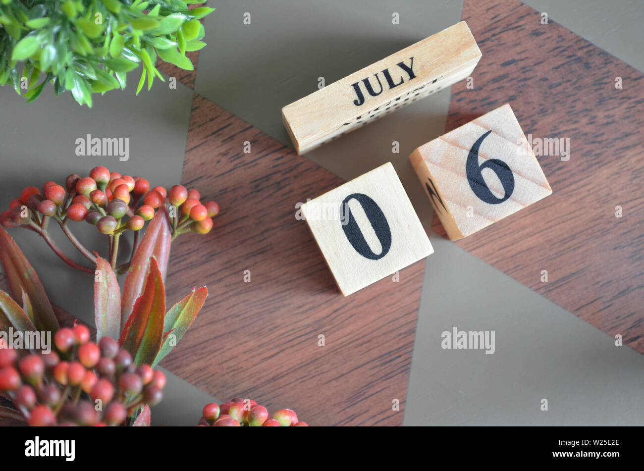 Date of July month. Diamond wood table for background. Stock Photo