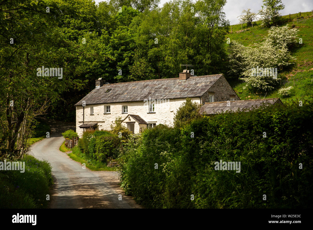 UK, Cumbria, Sedbergh, Lowgill, Crook of Lune, Pool House, isolated house by River Lune crossing Stock Photo